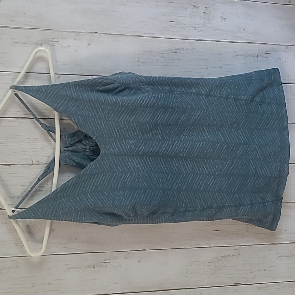 Prana blue tank with criss-cross tie back, built-in bra, patterned design.Size L